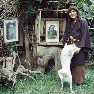 Monk with the paintings I bought from him, Dalat